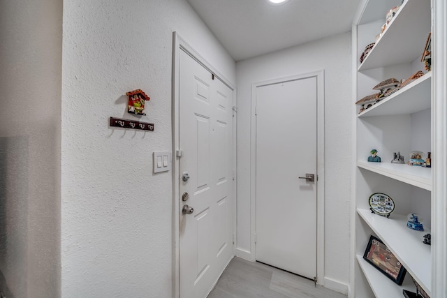 doorway with light hardwood / wood-style flooring