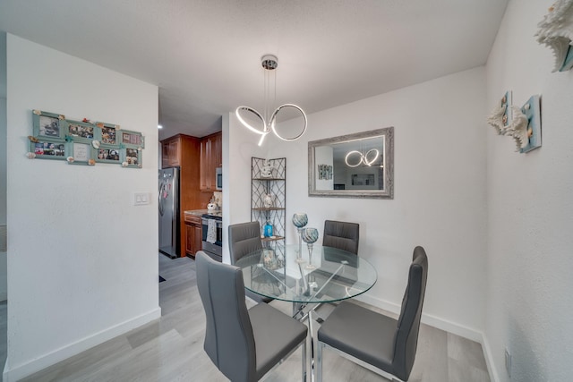 927 Riverside Dr Unit 313, Coral Springs, FL 33071 - dining space featuring light wood-type flooring and baseboards
