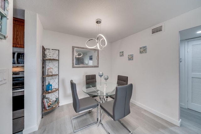 927 Riverside Dr Unit 313, Coral Springs, FL 33071 - dining area with wood finished floors and baseboards