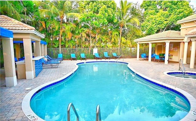 view of swimming pool with a patio