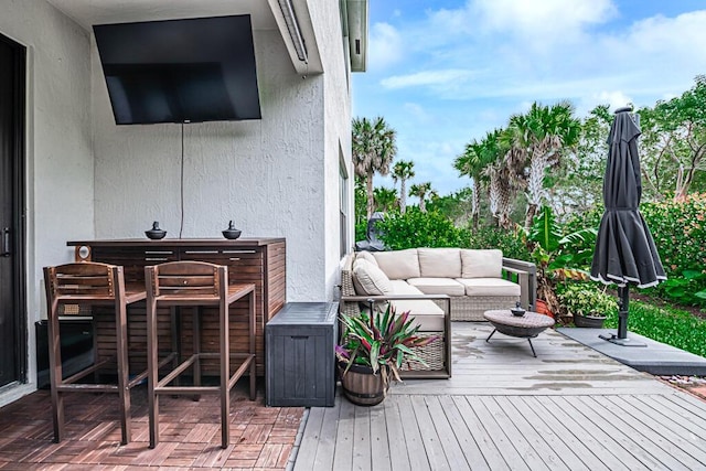 wooden deck featuring an outdoor hangout area