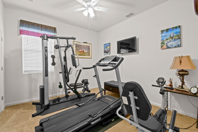 exercise room with ceiling fan, baseboards, visible vents, and carpet