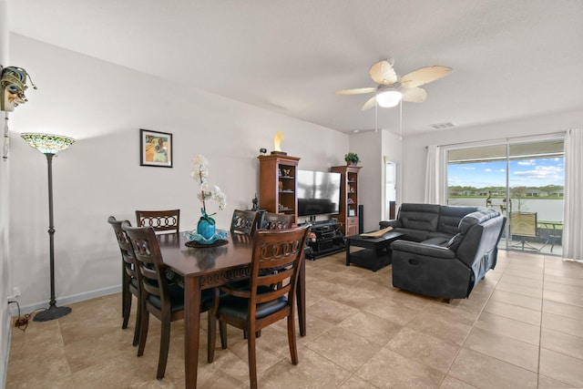 dining room with visible vents, ceiling fan, and light tile patterned floors