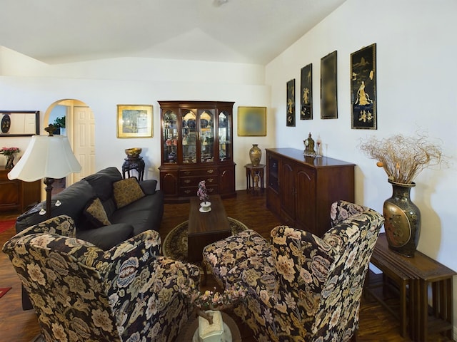 living room with vaulted ceiling and dark wood-type flooring