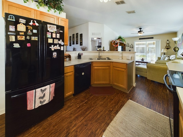 kitchen with sink, dark wood-type flooring, black appliances, and ceiling fan