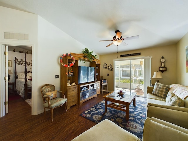 living room featuring ceiling fan and dark hardwood / wood-style flooring