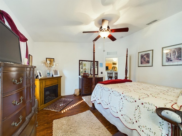 bedroom with ceiling fan and dark hardwood / wood-style floors