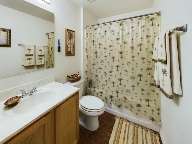 full bathroom featuring toilet, vanity, shower / bathtub combination with curtain, and wood-type flooring