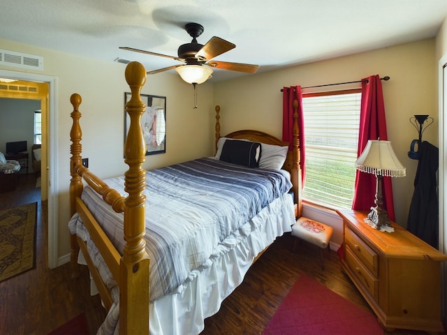 bedroom with ceiling fan and dark hardwood / wood-style floors