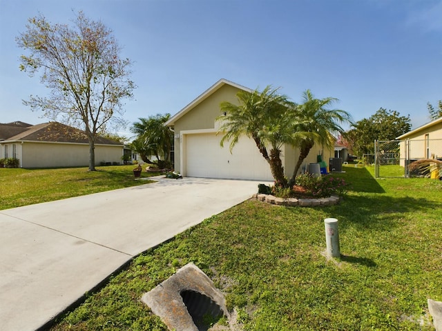 view of front of house with a garage and a front lawn