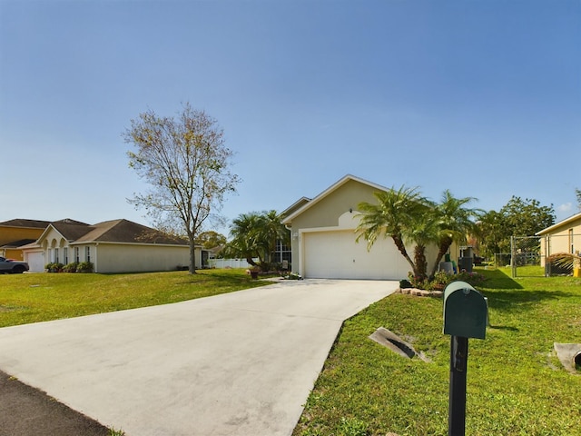 ranch-style home with a garage and a front yard