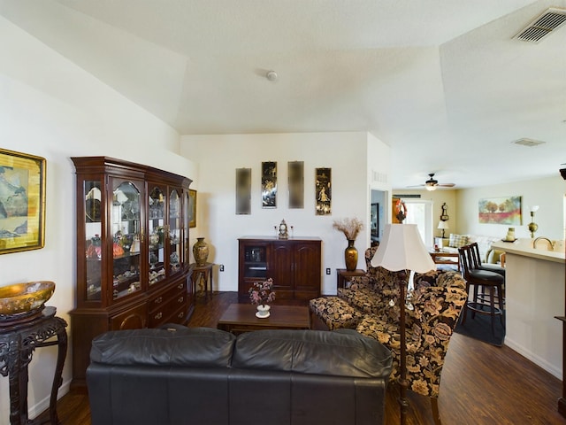 living room with dark wood-type flooring, sink, and ceiling fan