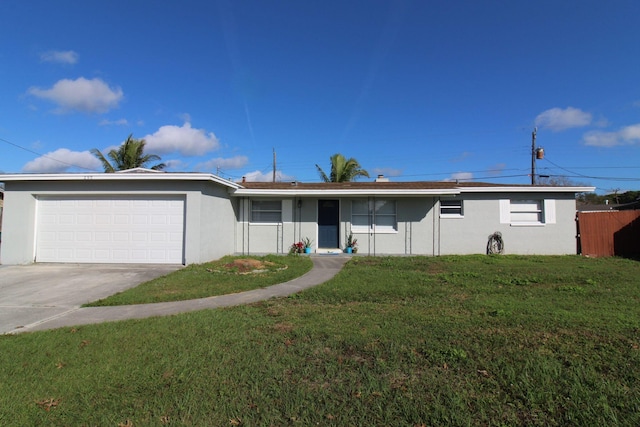 ranch-style house with stucco siding, driveway, a garage, and a front yard
