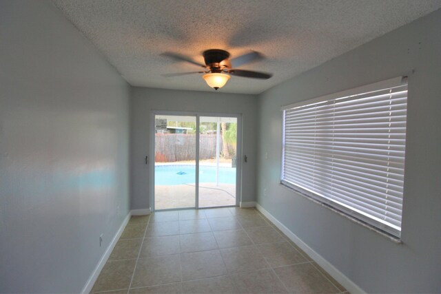 tiled bedroom with ceiling fan