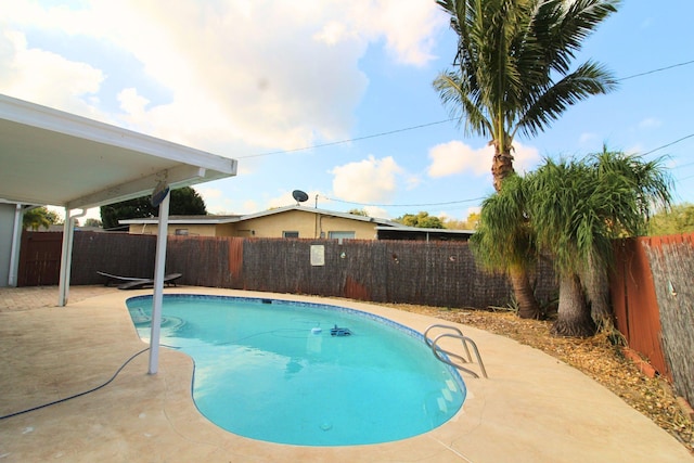view of pool with a fenced backyard, a fenced in pool, and a patio area