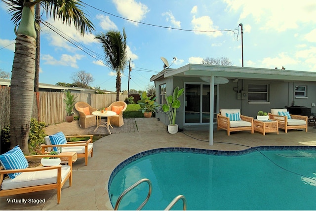 view of swimming pool with a fenced backyard, a patio area, outdoor lounge area, and a fenced in pool