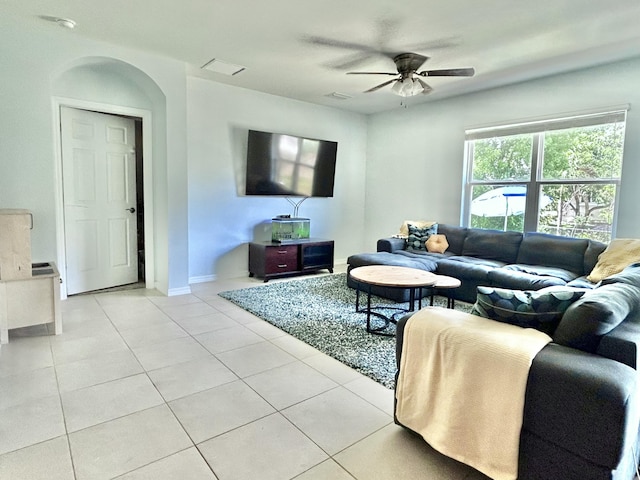 8519 Morris Rd, Fort Myers, FL 33967 - living area with light tile patterned flooring, ceiling fan, and baseboards