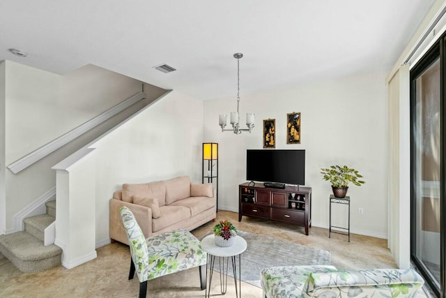 living area featuring visible vents, a notable chandelier, stairway, and baseboards