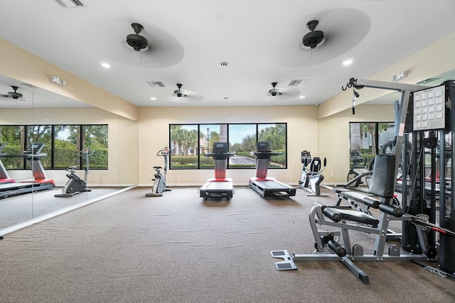 gym featuring a healthy amount of sunlight, ceiling fan, visible vents, and recessed lighting