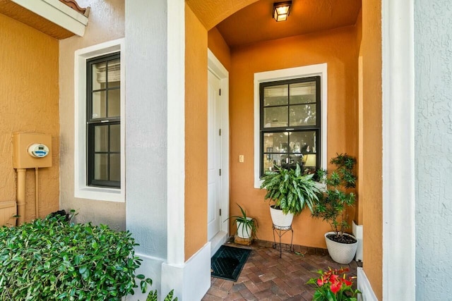 doorway to property with stucco siding