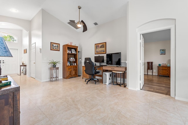 7087 Lombardy St, Boynton Beach, FL 33472 - office featuring light tile patterned floors, arched walkways, visible vents, and high vaulted ceiling