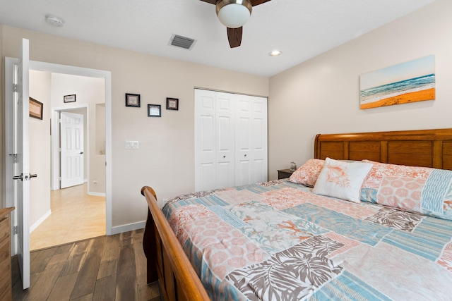 7087 Lombardy St, Boynton Beach, FL 33472 - bedroom featuring baseboards, visible vents, dark wood finished floors, ceiling fan, and a closet