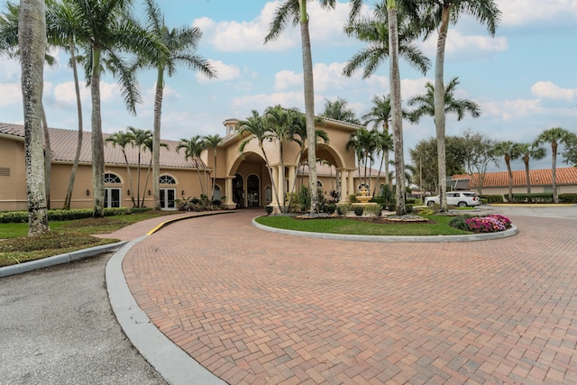 7087 Lombardy St, Boynton Beach, FL 33472 - view of front facade featuring curved driveway