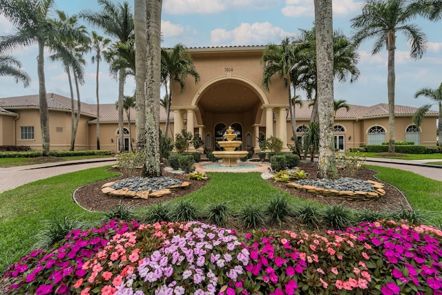 7087 Lombardy St, Boynton Beach, FL 33472 - exterior space with stucco siding, curved driveway, and a tiled roof