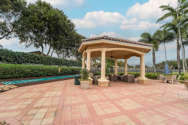 7087 Lombardy St, Boynton Beach, FL 33472 - view of patio with a gazebo, shuffleboard, a ceiling fan, and fence