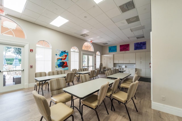 7087 Lombardy St, Boynton Beach, FL 33472 - dining space with visible vents, plenty of natural light, light wood-type flooring, and a drop ceiling