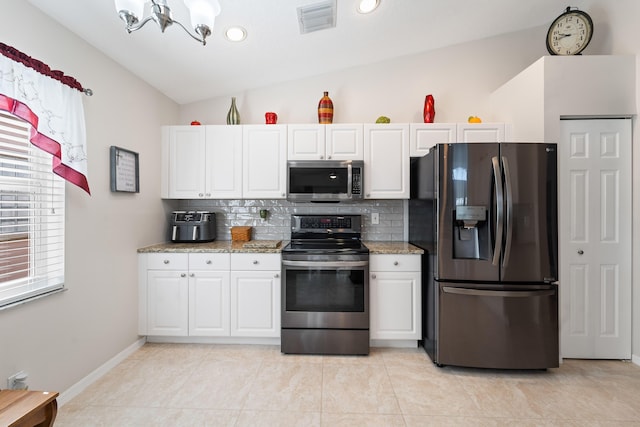 7087 Lombardy St, Boynton Beach, FL 33472 - kitchen with visible vents, stainless steel appliances, white cabinets, decorative backsplash, and a chandelier