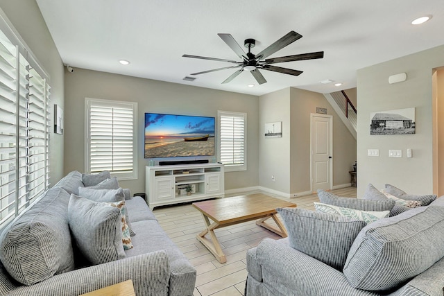 living area featuring ceiling fan, recessed lighting, visible vents, light wood-style floors, and baseboards