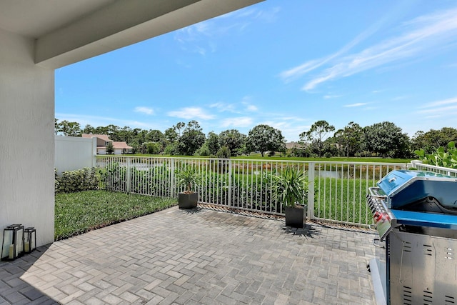 view of patio / terrace featuring fence