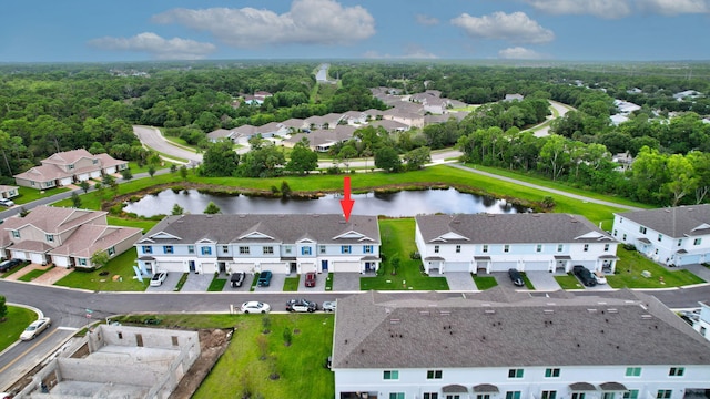 birds eye view of property with a water view and a residential view