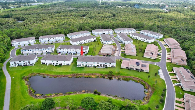 aerial view featuring a residential view, a water view, and a forest view