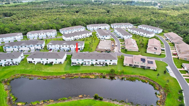 drone / aerial view with a residential view and a water view