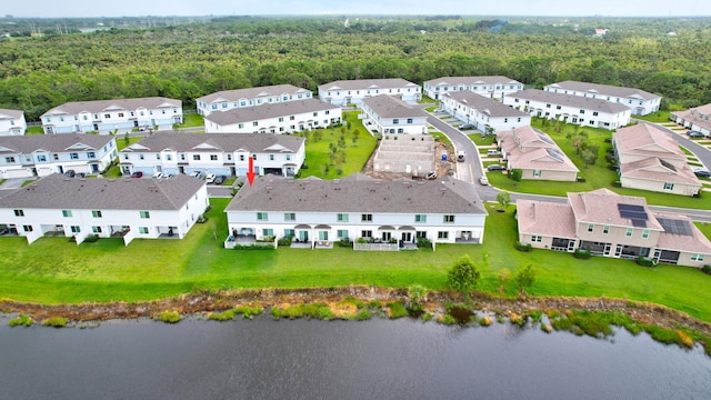 aerial view featuring a residential view and a water view