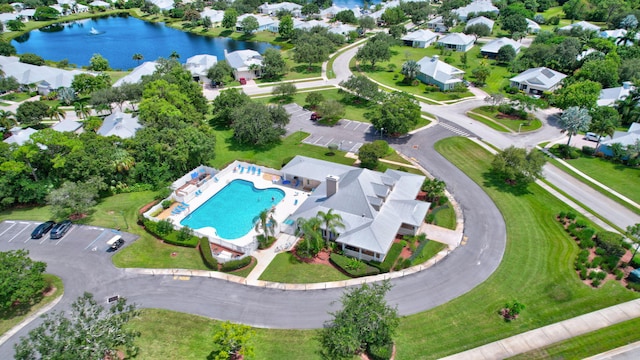 drone / aerial view with a water view and a residential view