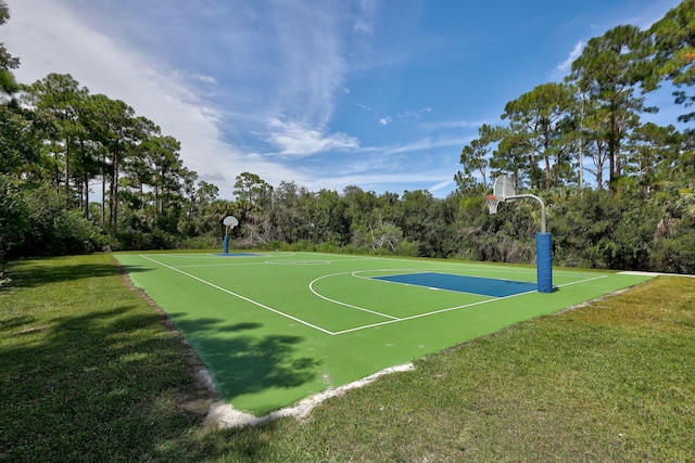 view of sport court with a yard and community basketball court