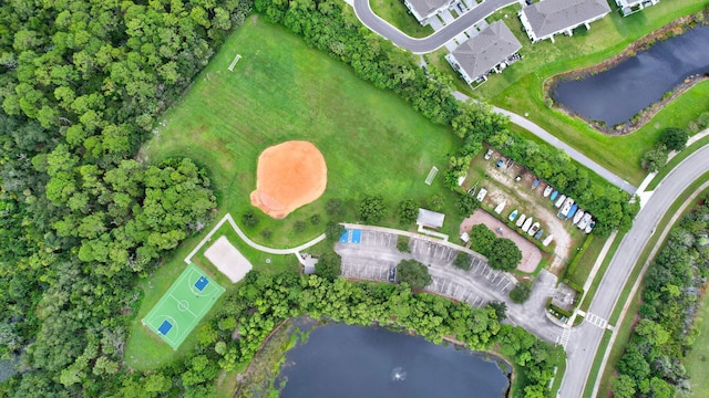 birds eye view of property featuring a water view