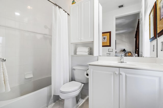 bathroom featuring toilet, visible vents, vanity, tile patterned floors, and shower / bath combo with shower curtain