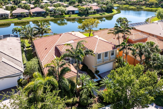 bird's eye view with a residential view and a water view