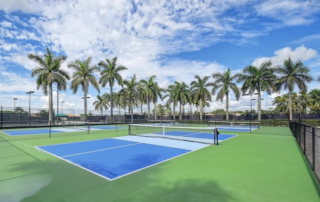 view of sport court featuring fence