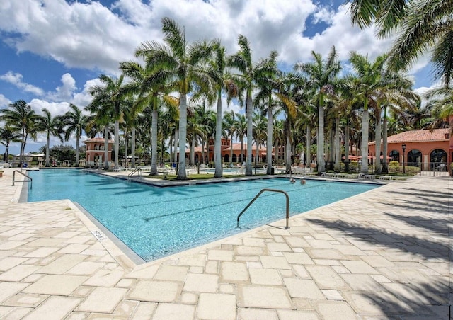 community pool with a patio area