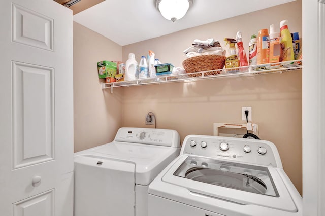 clothes washing area with laundry area and independent washer and dryer