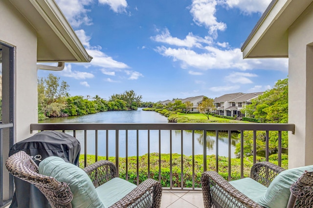 balcony featuring a water view and a residential view