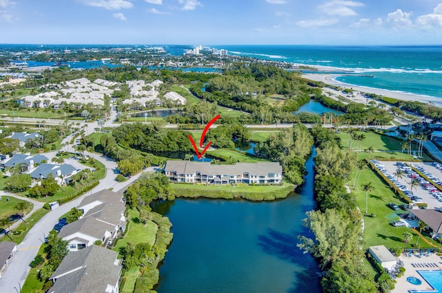 drone / aerial view with a residential view and a water view