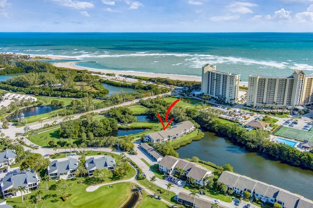 aerial view featuring a view of the beach and a water view