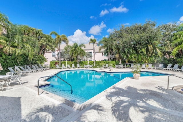 community pool featuring a patio area