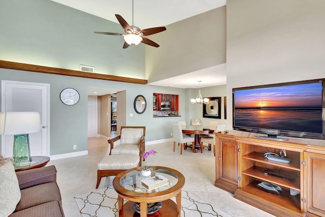 living room with ceiling fan with notable chandelier, light tile patterned floors, visible vents, and baseboards